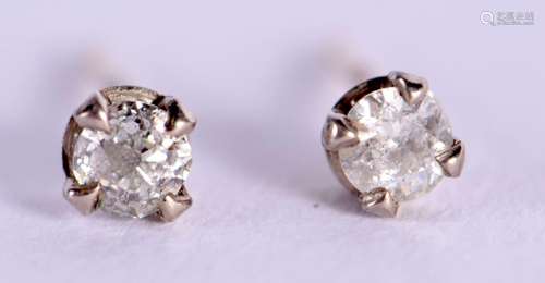 A PAIR OF DIAMOND EARRINGS. Each 1/16th of a carat