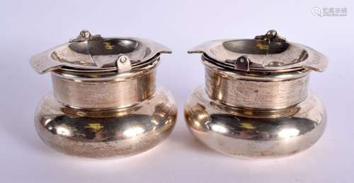 A PAIR OF SILVER SWING TOP ASHTRAYS. Hallmarked Birmingham 1...