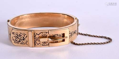 A YELLOW METAL BANGLE IN THE VICTORIAN STILE. 5.8cm X 4.5cm,...