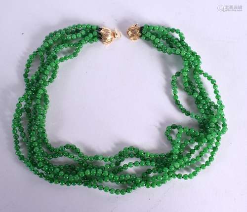 A JADE NECKLACE WITH 14K GOLD CLASP. Stamped 14k, length 62c...