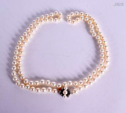 PEARL NECKLACE WITH A 14K GOLD AND DIAMOND CLASP. Length 83c...