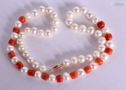 STRING OF PEARL AND CORAL BEADS WITH A 14CT GOLD CLASP. Stam...