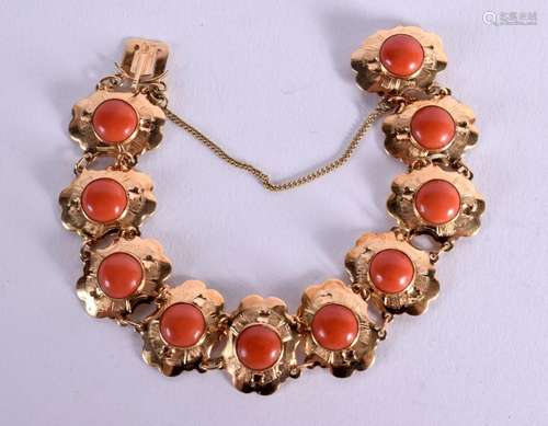 AN ANTIQUE GOLD AND CORAL BRACELET. Internal diameter 5.3cm,...