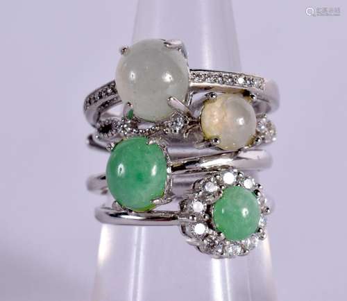 FOUR CONTINENTAL SILVER AND JADE RINGS. Stamped 925, Sizes K...