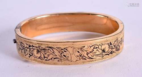 A VICTORIAN STYLE YELLOW METAL BANGLE. Internal diameter 5.4...