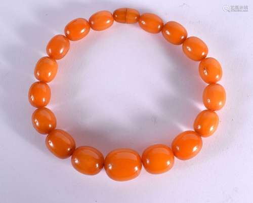 A LARGE ART DECO ORANGE AMBER TYPE BEAD NECKLACE. 140 grams....