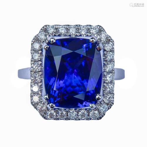 An 18ct white gold tanzanite and diamond cluster ring,