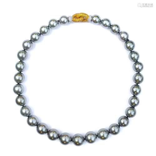 A grey cultured pearl necklace with 18ct bi-colour gold yell...