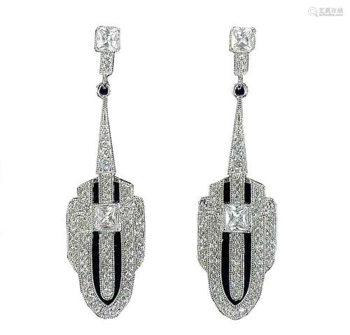 A pair of Art Deco style white metal white stone set pendant...