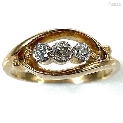 An early 20th century 18ct gold three stone milgrain set dia...