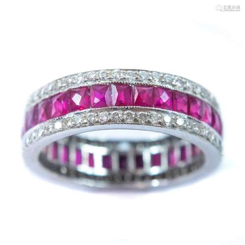 An 18ct white gold diamond and ruby set full eternity ring.