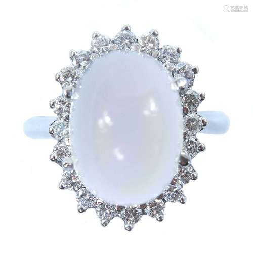 An 18ct white gold moonstone and diamond cluster ring.