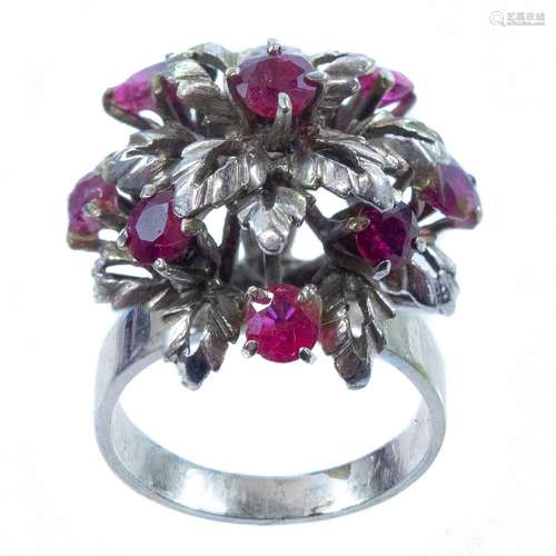 A 9ct (tested) white gold ruby set dress ring.