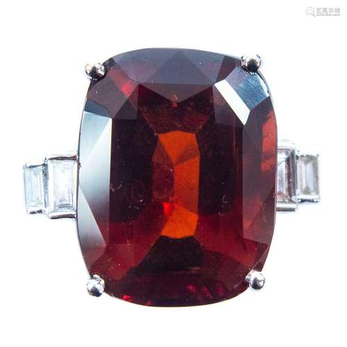 An 18ct white gold garnet and diamond set dress ring.