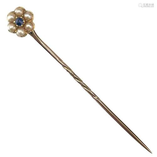 A gold sapphire and pearl flowerhead stick pin.