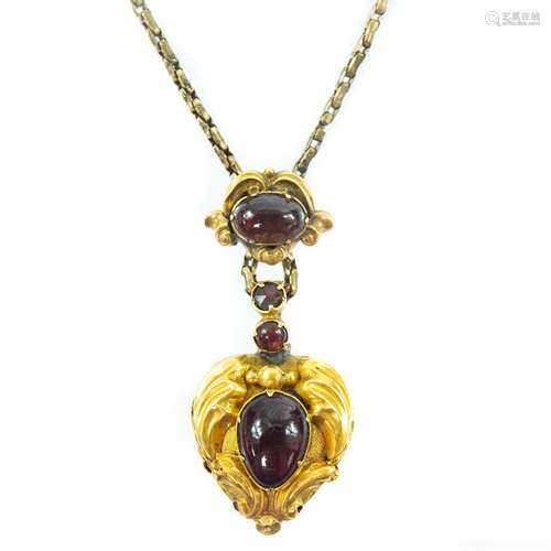 A Victorian gold carbuncle garnet set heart shaped pendant l...