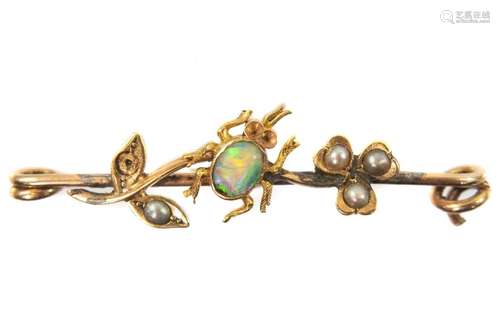 A Victorian gold pin brooch applied with an insect on a flow...