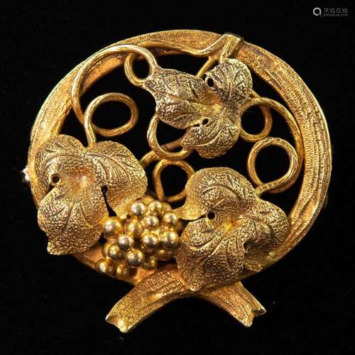 A late 19th century gold fruiting vine openwork brooch with ...