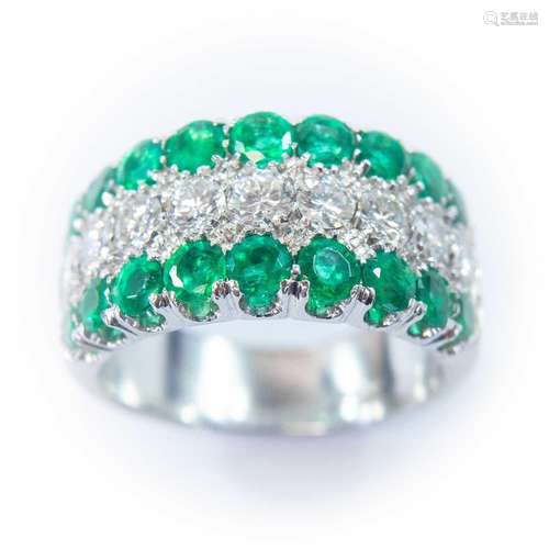 An 18ct white gold diamond and emerald half eternity ring, s...