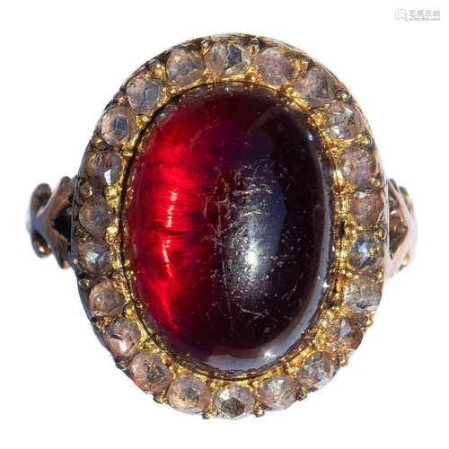 A Georgian gold garnet and diamond set ring, the oval garnet...