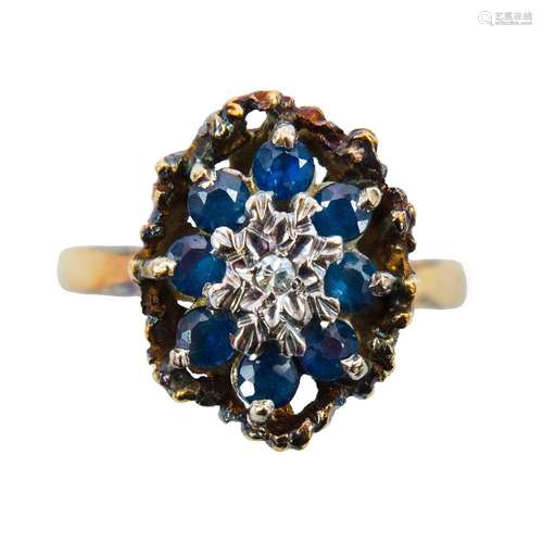 A 1970`s 18ct gold diamond and sapphire cluster ring