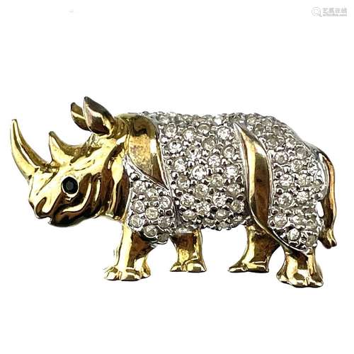 A French silver gilt paste set brooch in the form of a Rhino...