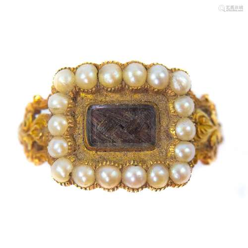 A Georgian high purity gold seed pearl set mourning ring wit...