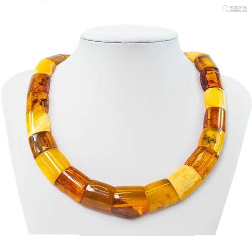 A contemporary multi-coloured amber panel bead necklace with...