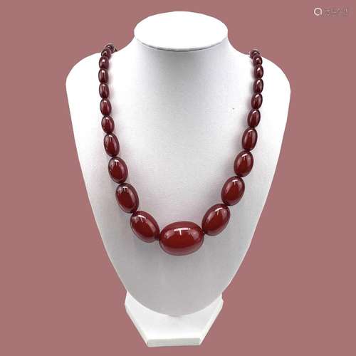 Cherry Amber Bakelite, with oval graduated beads.