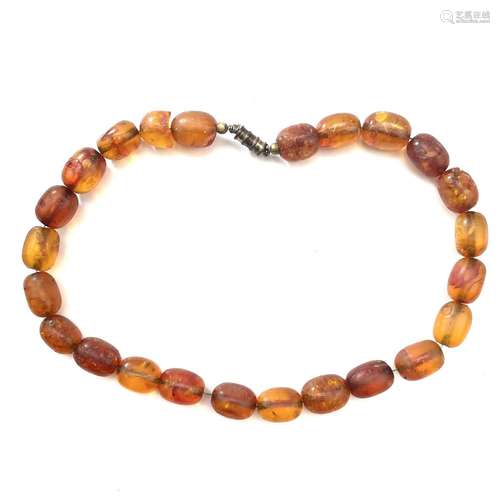 An amber oval bead necklace.