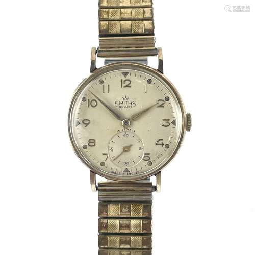 A Smiths Deluxe 9ct gold 1940`s gentleman`s wristwatch, manu...