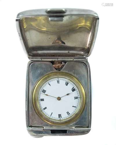 A George V silver cased travelling crown wind timepiece.