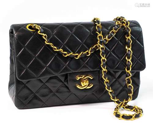 A Chanel Double Flap handbag in black lambskin with gold ton...