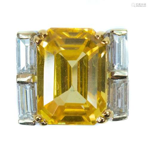 Boucheron - A yellow sapphire and diamond platinum ring.