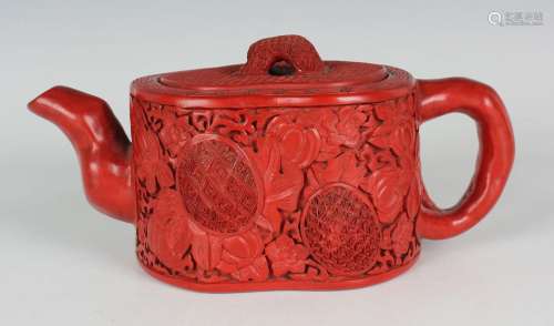 A Chinese cinnabar lacquered Yixing stoneware teapot and cov...