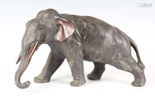 A Japanese brown patinated bronze figure of an elephant