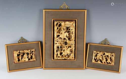 A Chinese carved and pierced giltwood rectangular panel