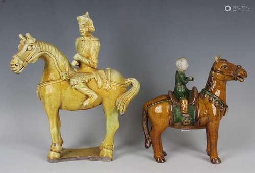 A Chinese sancai glazed biscuit porcelain equestrian figure ...