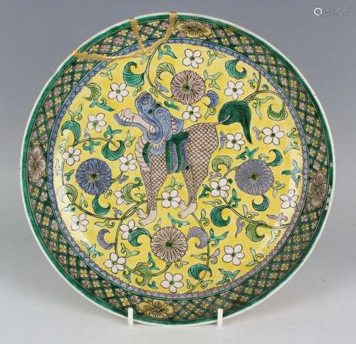 A Chinese famille verte yellow ground enamelled biscuit porc...