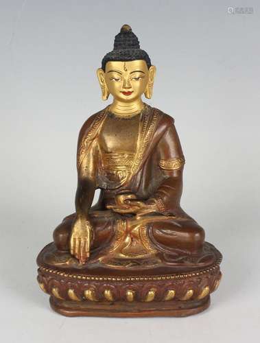 A Sino-Tibetan brown patinated bronze figure of Buddha