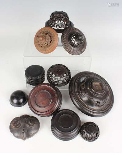 A collection of ten Chinese hardwood circular covers/lids