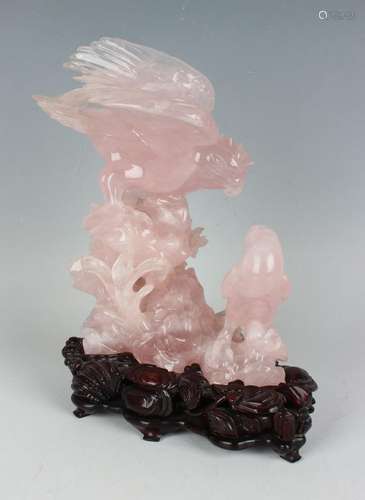 A Chinese carved rose quartz figure group of two birds