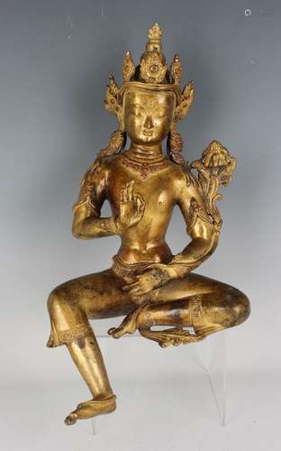 A Tibetan gilt bronze figure of a bodhisattva