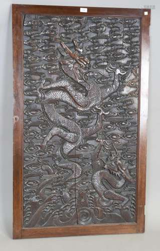 A Chinese carved hardwood rectangular panel
