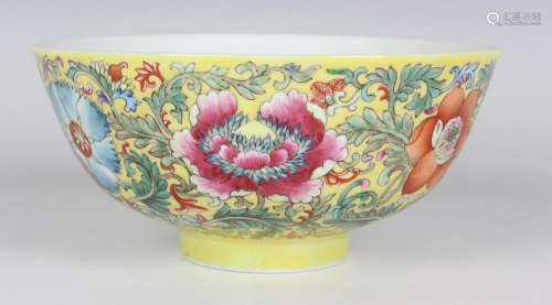 A Chinese famille rose yellow ground porcelain bowl