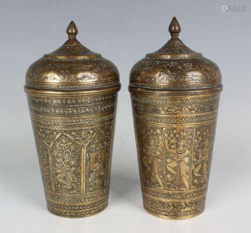 A near pair of Indian brass beakers and domed covers