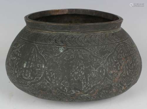 A Persian brass bowl
