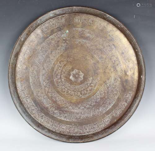 An Egyptian brass circular tray