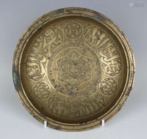 A Persian bronze circular bowl