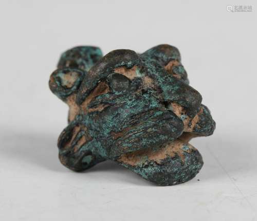 A verdigris cast bronze lion mask pendant with suspension lo...